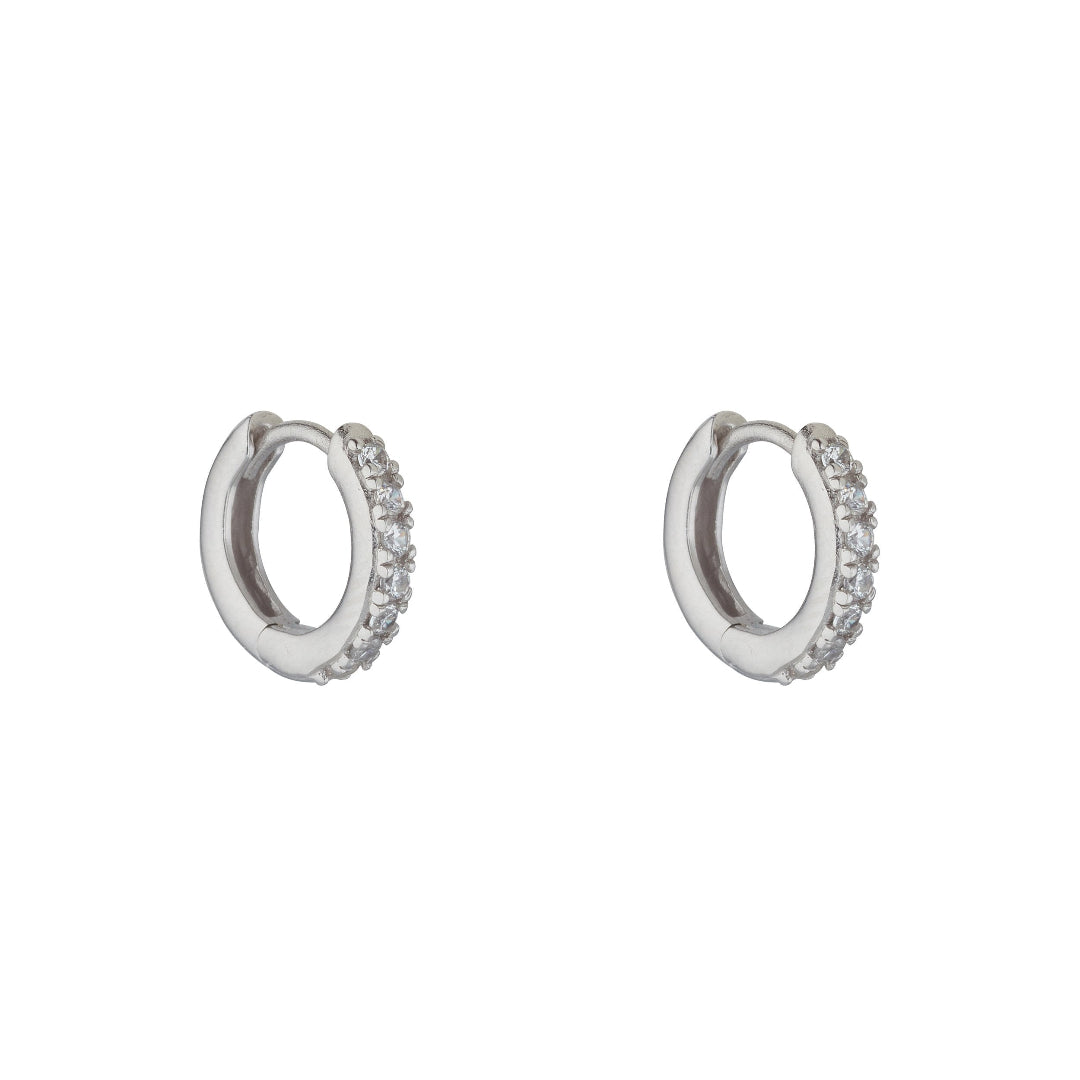 silver cubic set huggie earrings on white background