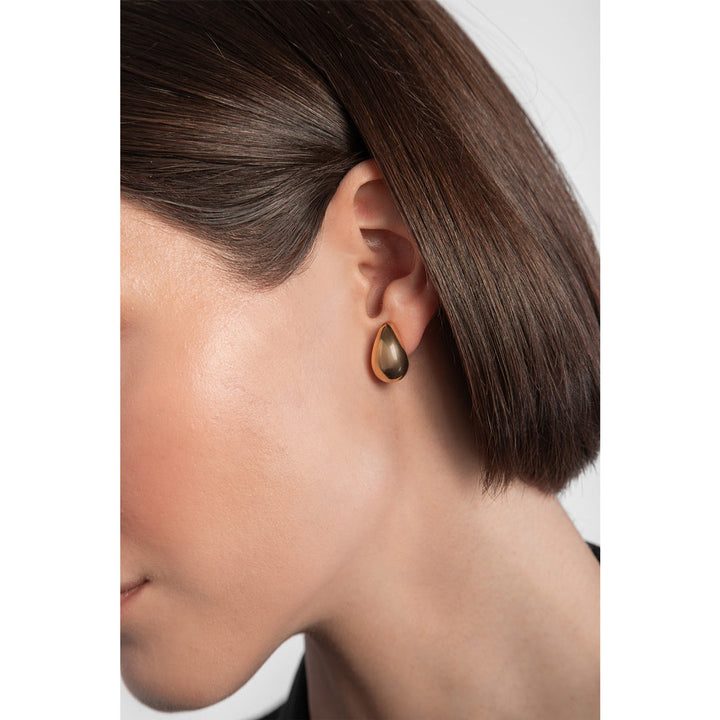 gold plated chunky tear drop earrings on model
