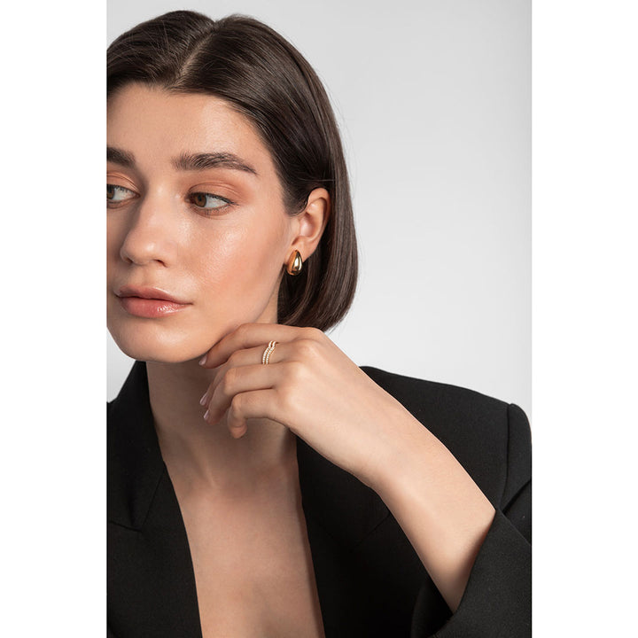 gold plated chunky tear drop earrings on model