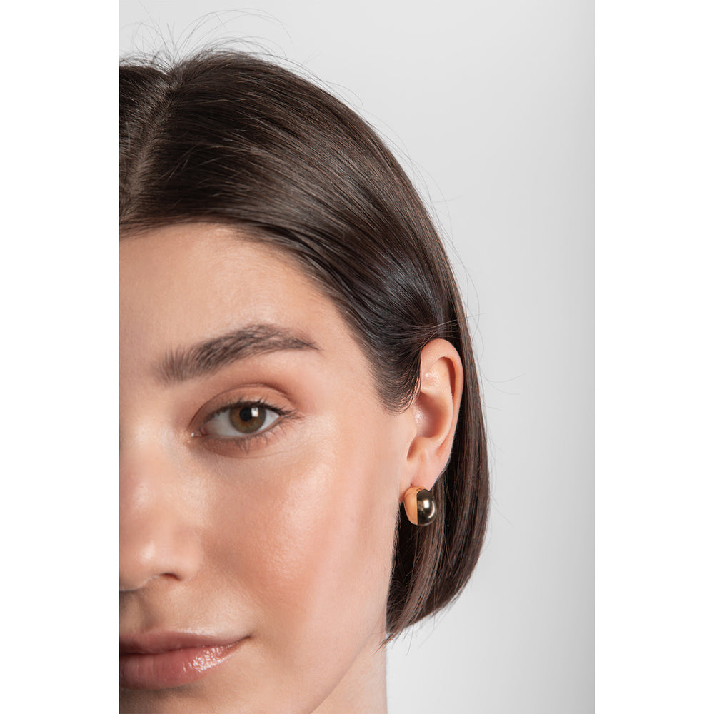 Model wearing chunky gold plated bulbous earrings from NJO Designs