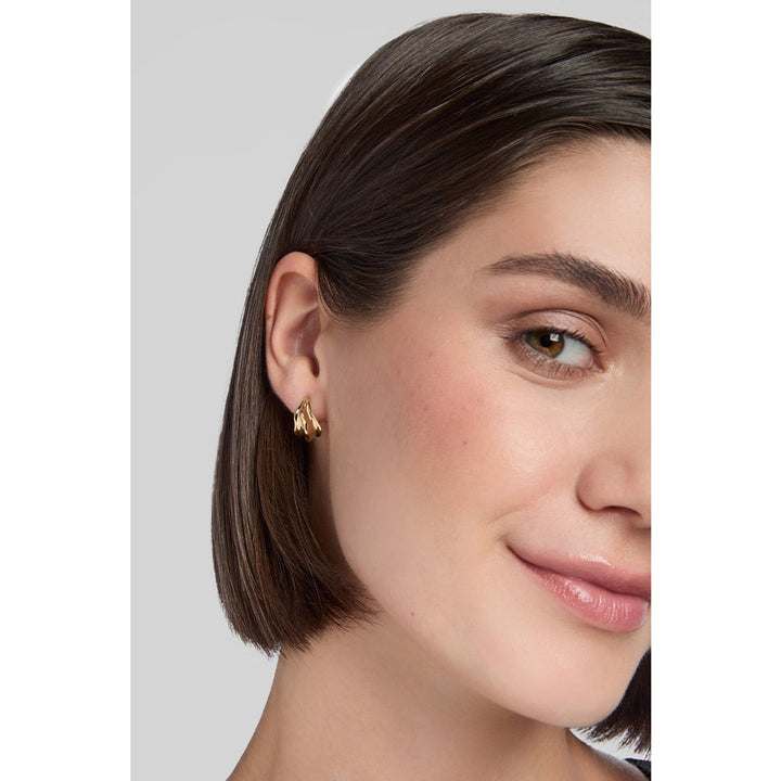 gold plated molten hoop earrings on model