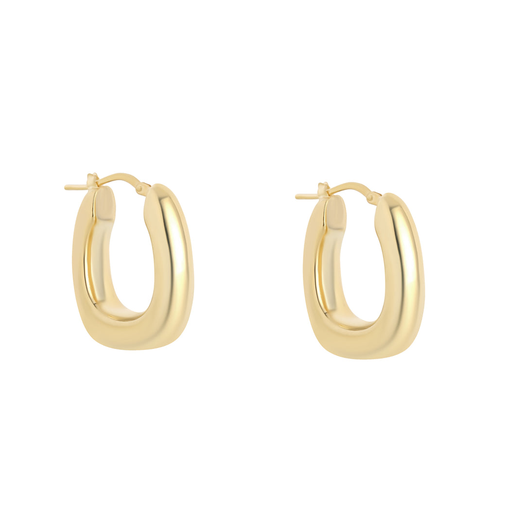 gold plated chunky oval hoop earrings on white background