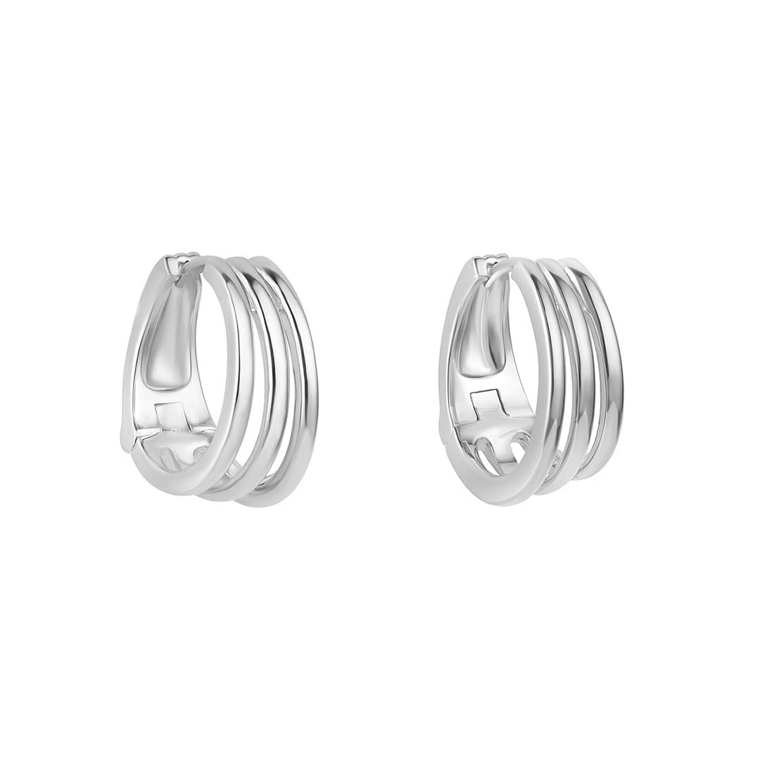 silver chunky stacked huggie earrings on white background