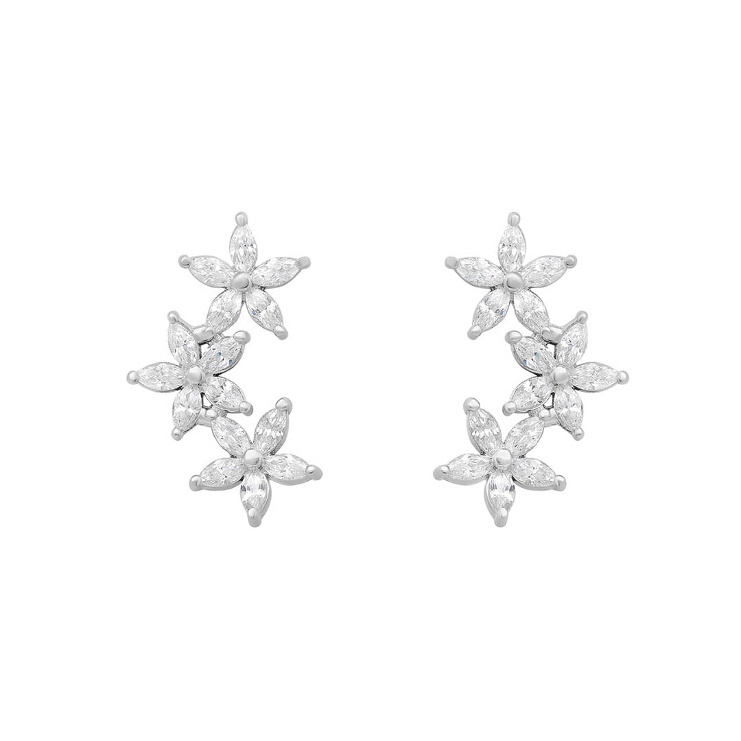 silver cz flower climber earrings on white background