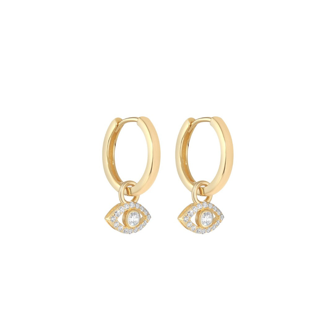 gold plated evil eye cz huggie earrings on white background