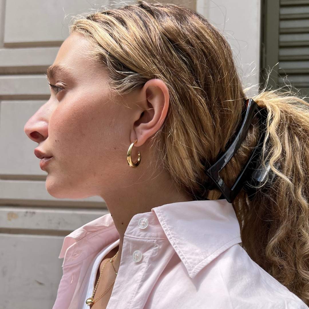 gold plated hoop earrings on model