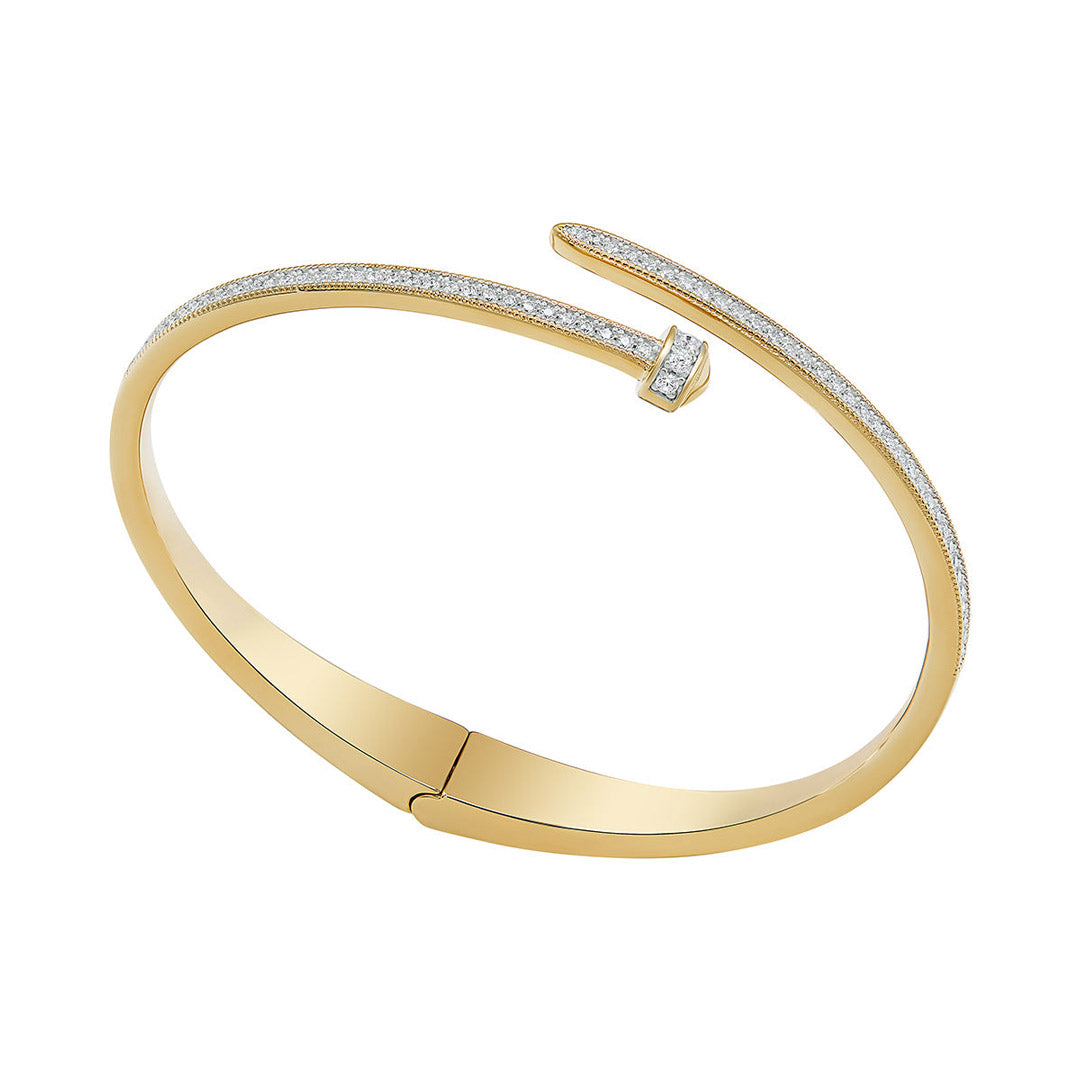 gold plated cz nail bangle on white background