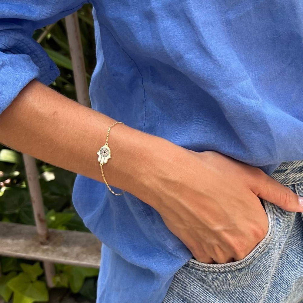 model wearing gold plated white hand of fatima bracelet