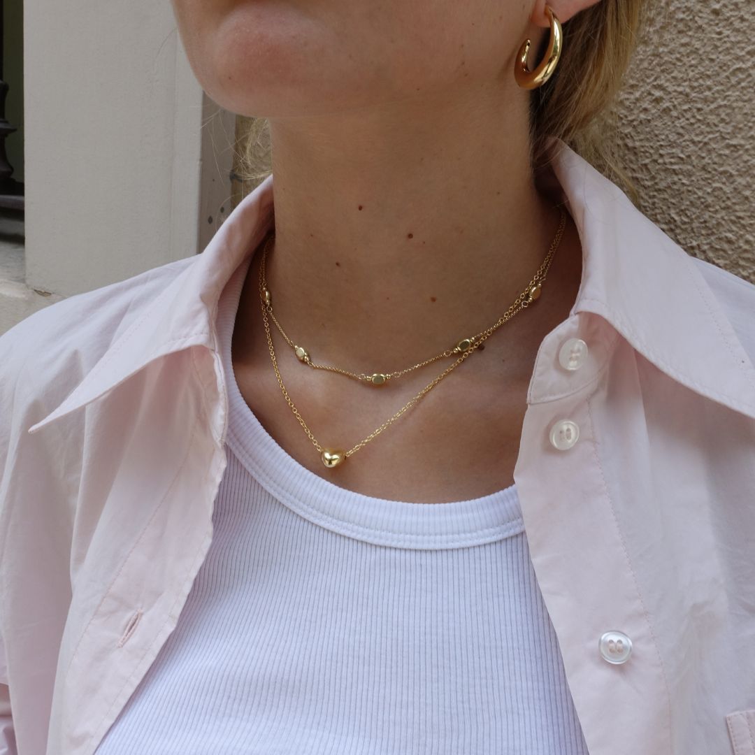 gold plated layered necklaces on model