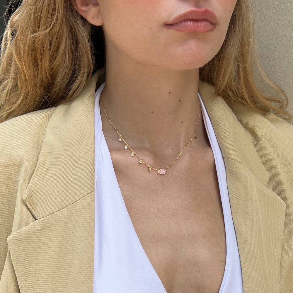 gold plated pink evil eye cz charm necklace on model