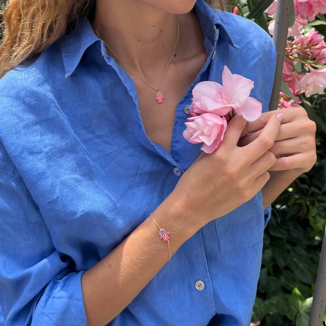 gold plated pink hand of fatima jewellery on model