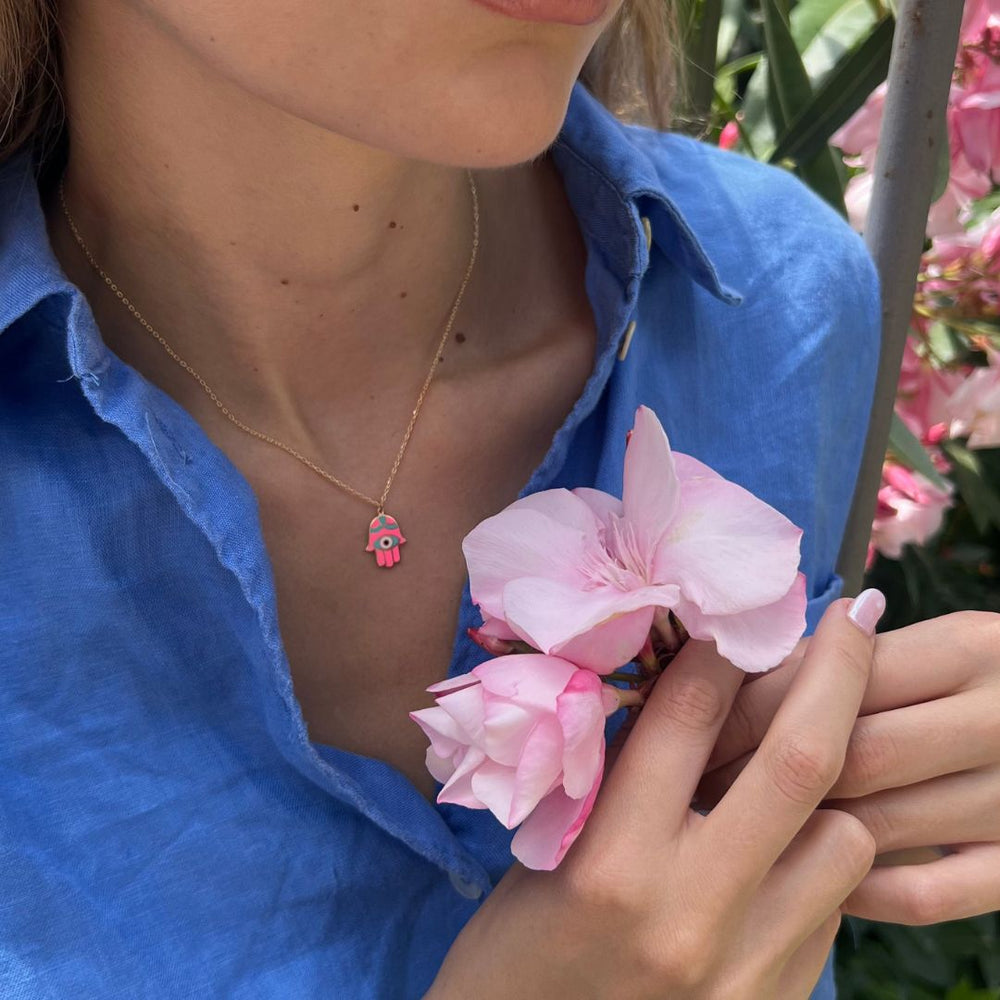 gold plated pink hand of fatima necklace on model