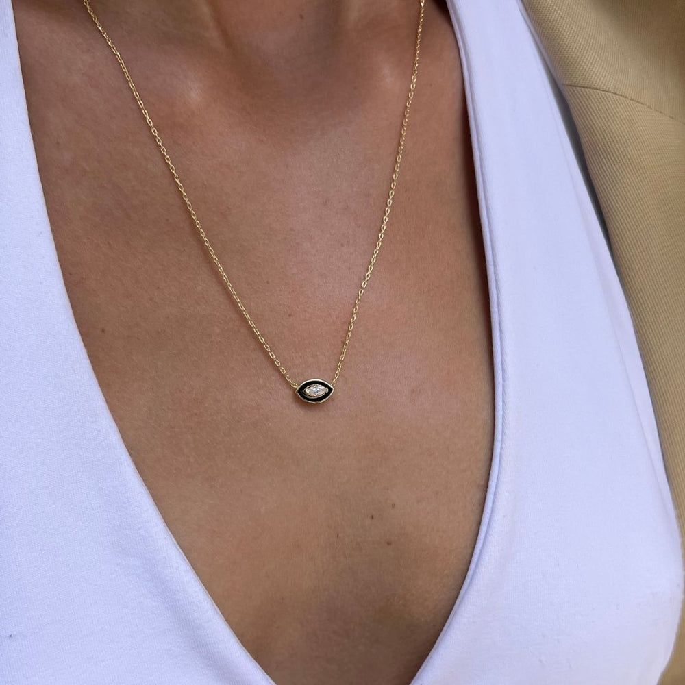 gold plated black evil eye necklace on model