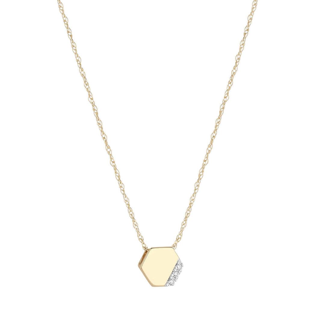 9ct gold diamond hex pendant on white background