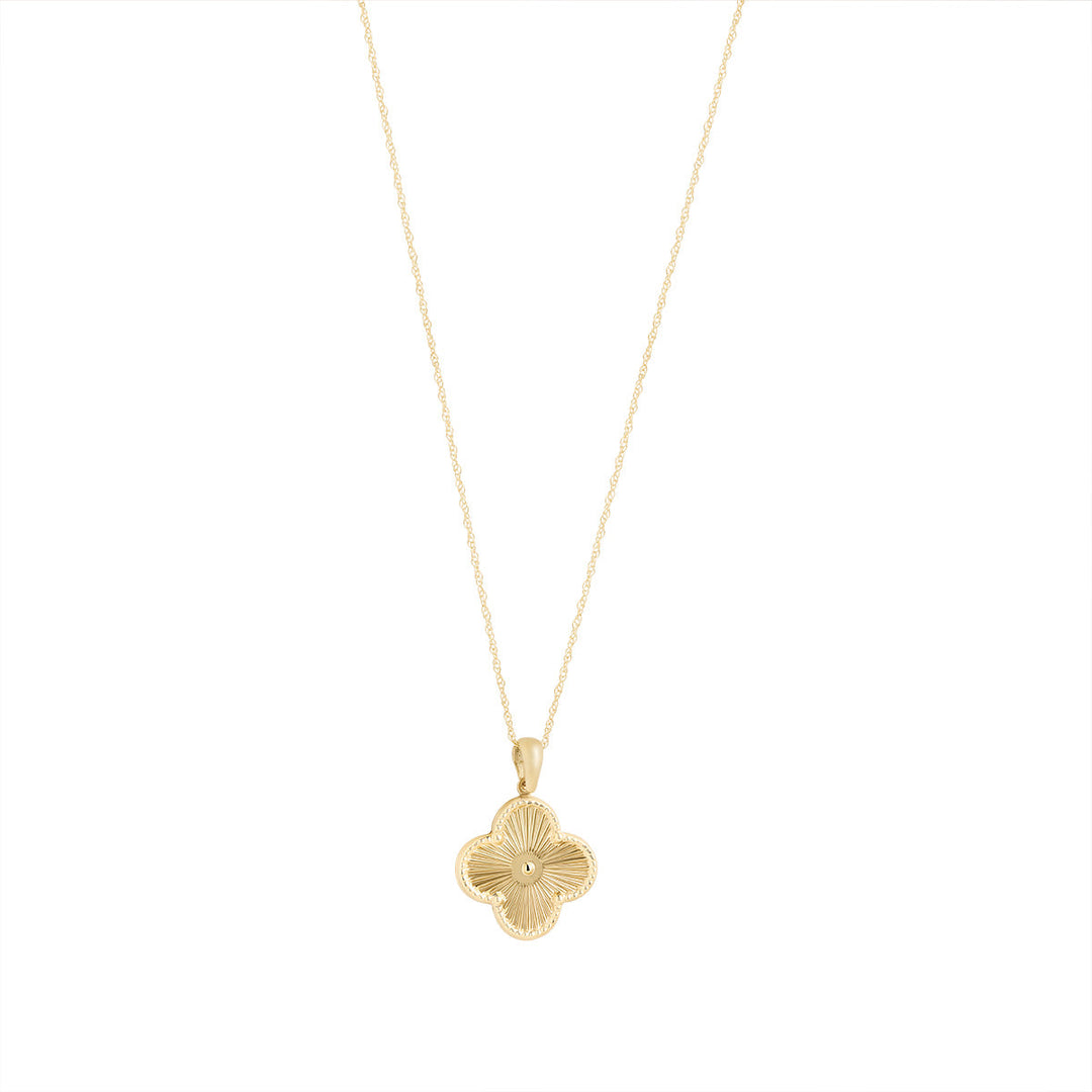 9ct gold textured clover pendant on white background