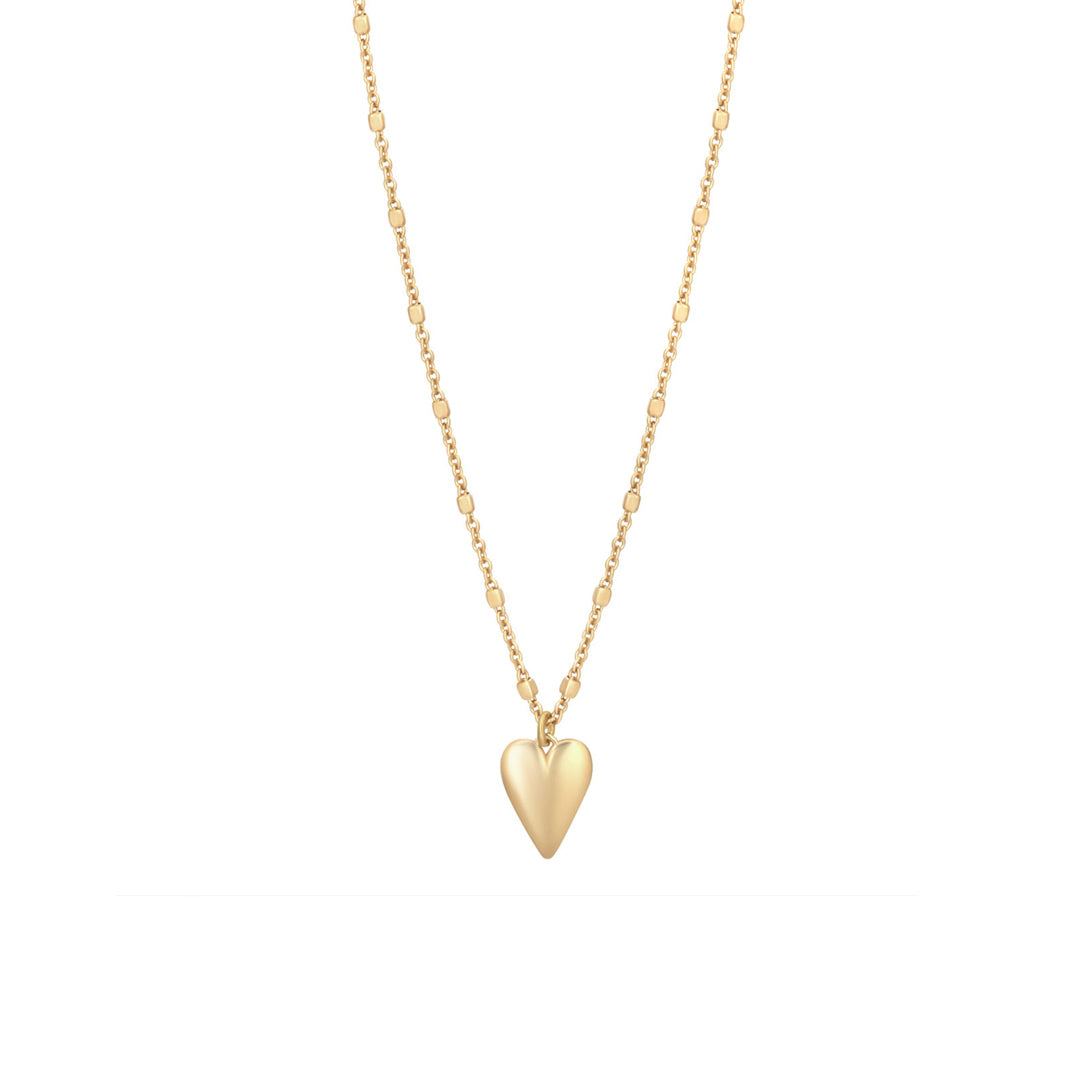 gold plated heart drop necklace on white background