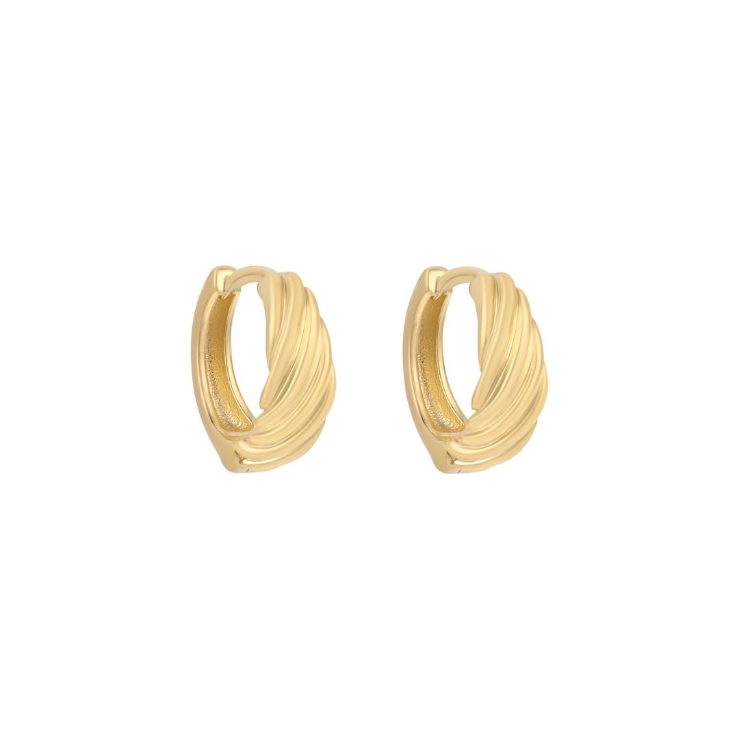 gold plated twisted huggie earrings on white background