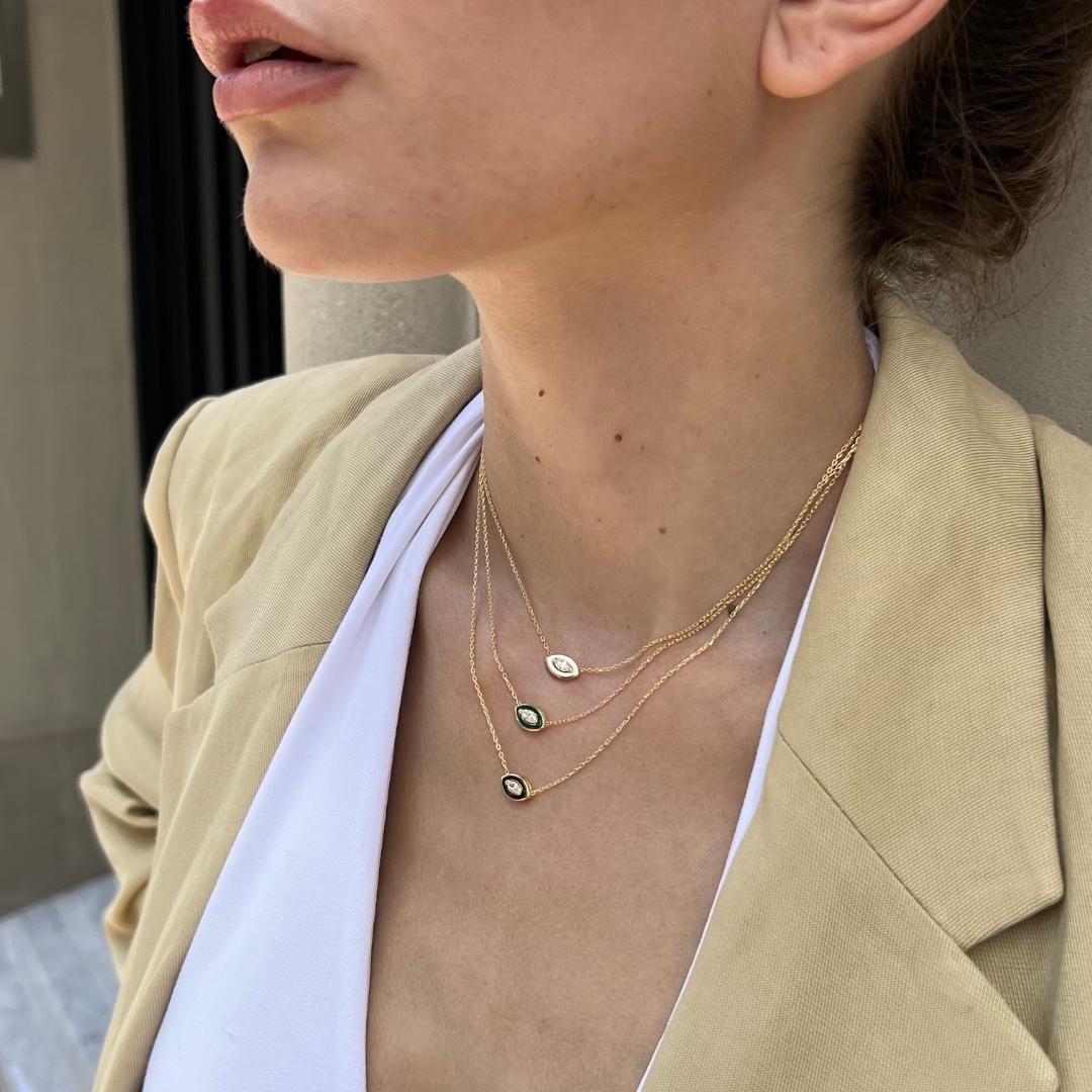 model wearing gold plated evil eye necklaces