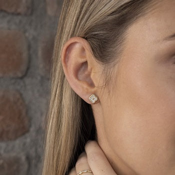 model wearing stud earrings