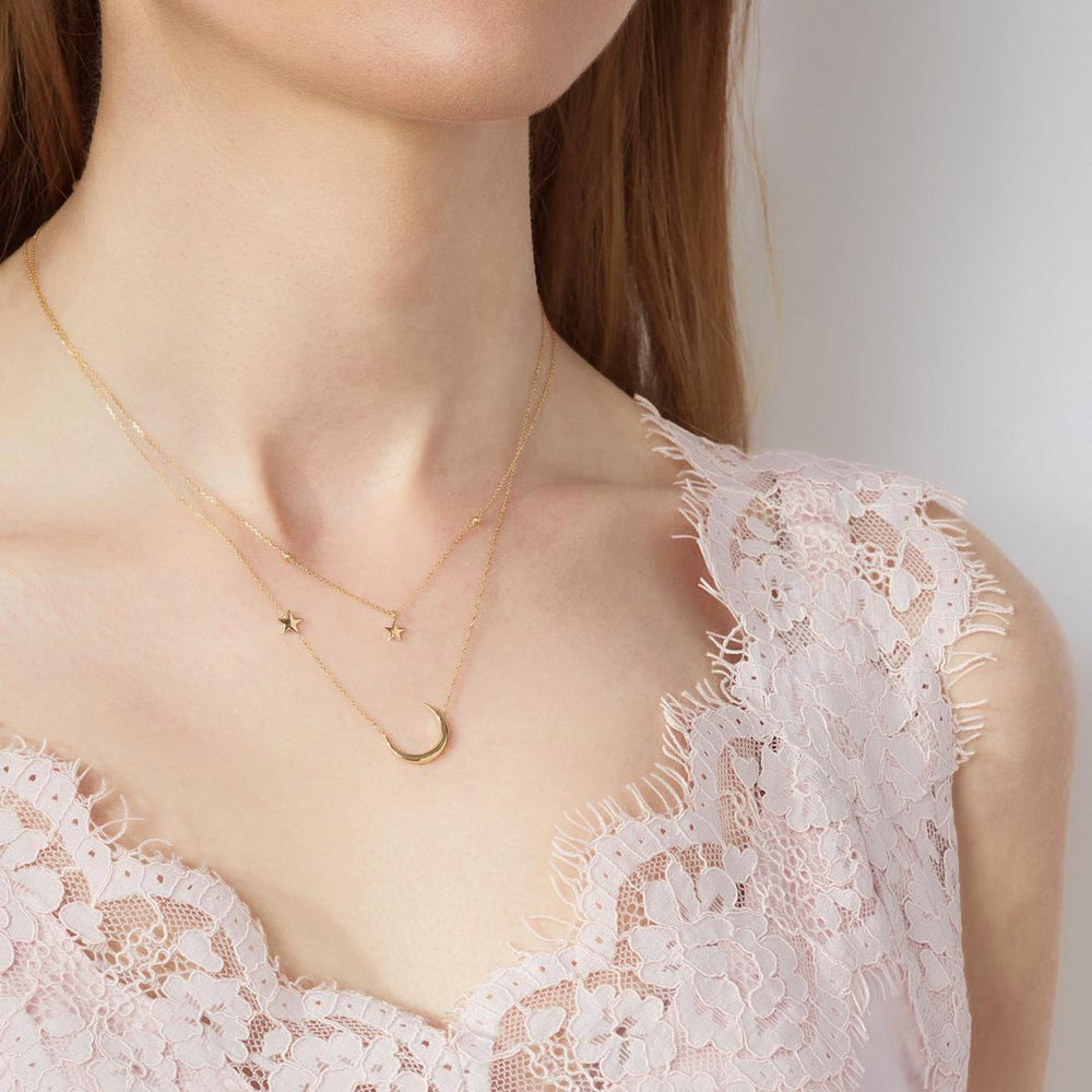 Model wearing 9ct Gold Moon & North Star Necklace