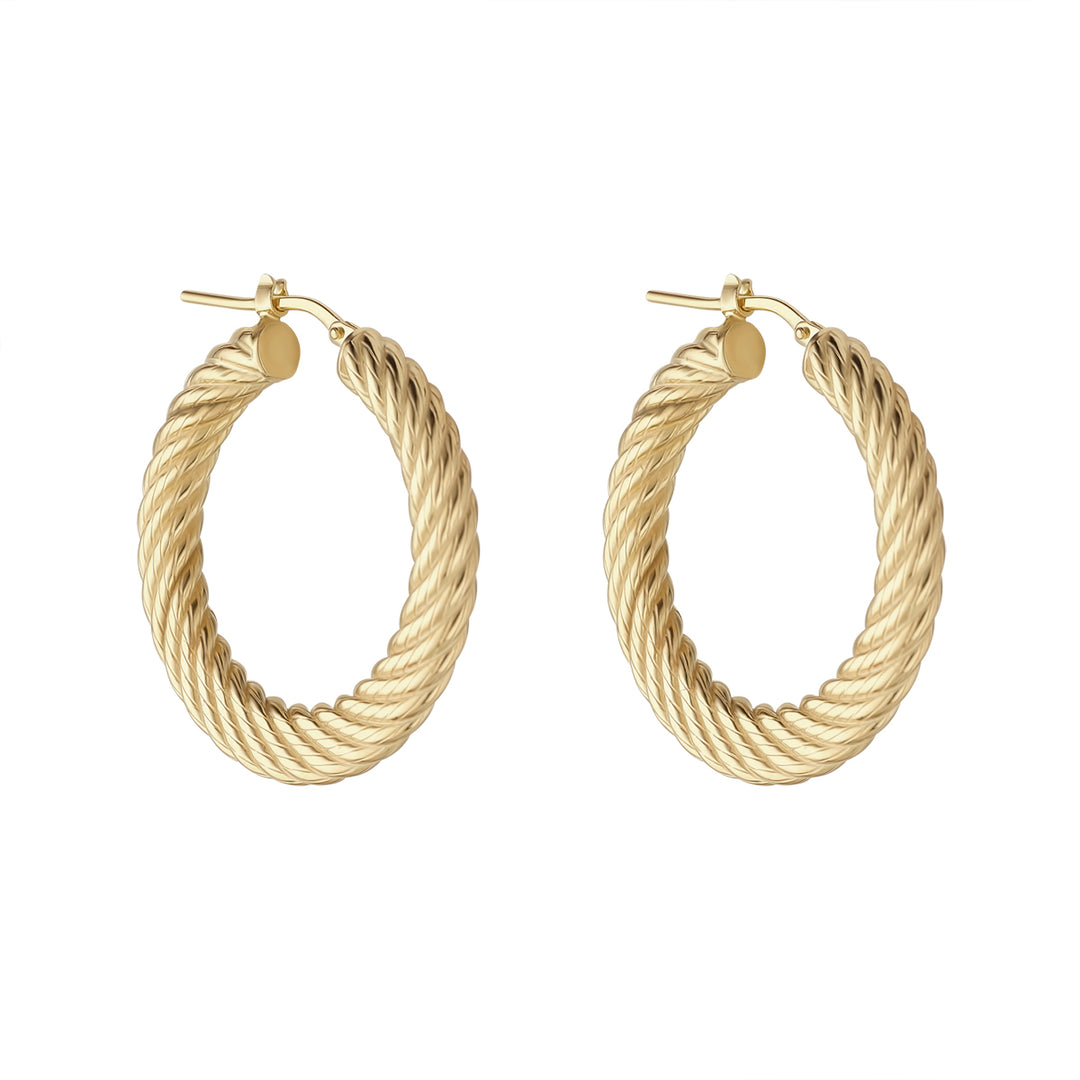 gold large croissant hoop earrings on white background