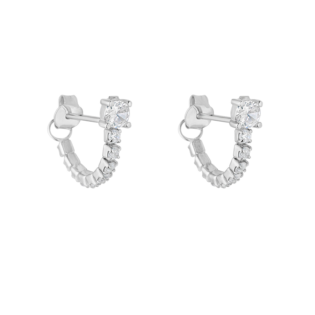 silver tennis style cubic zirconia huggies on white background