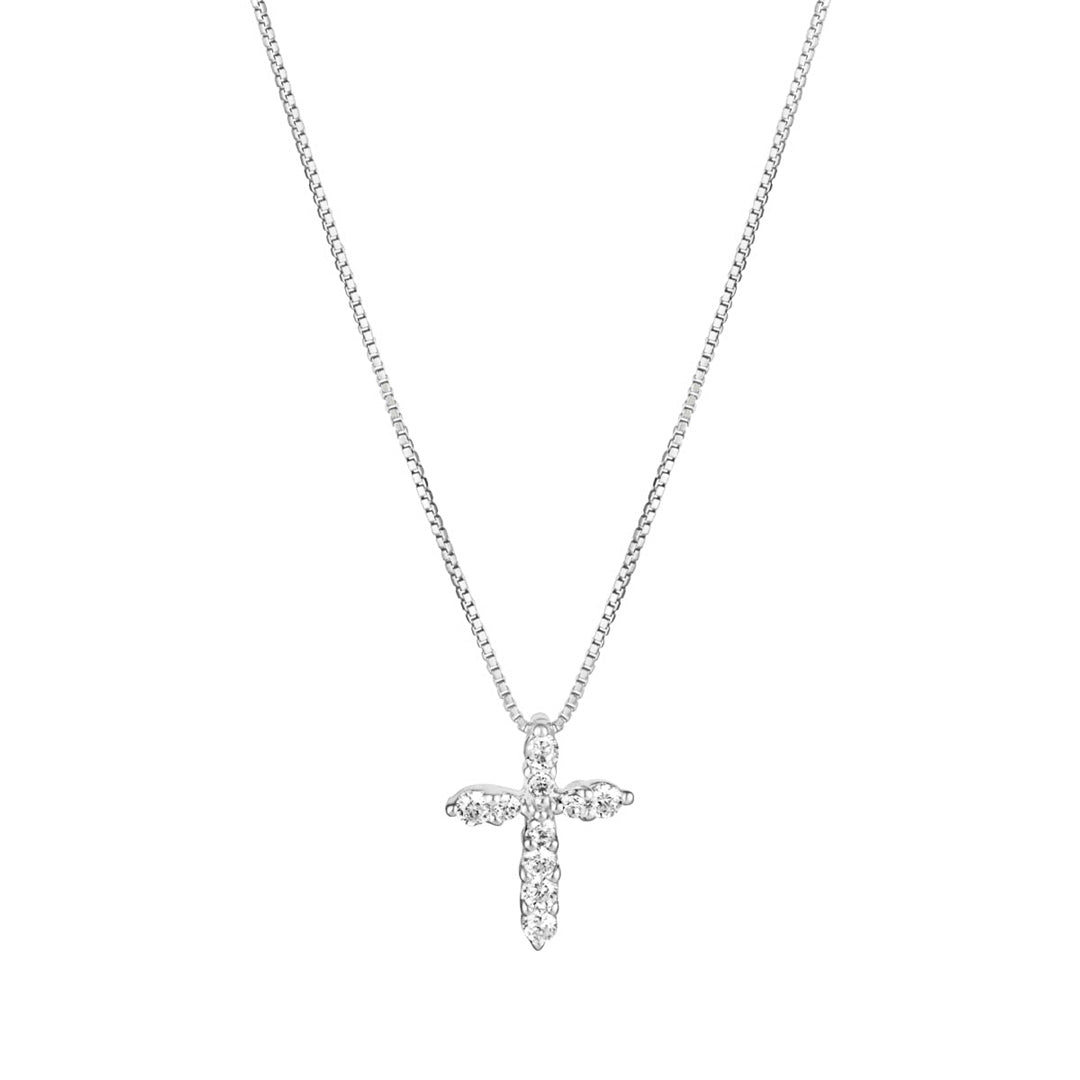 small crystal cross pendant on white background