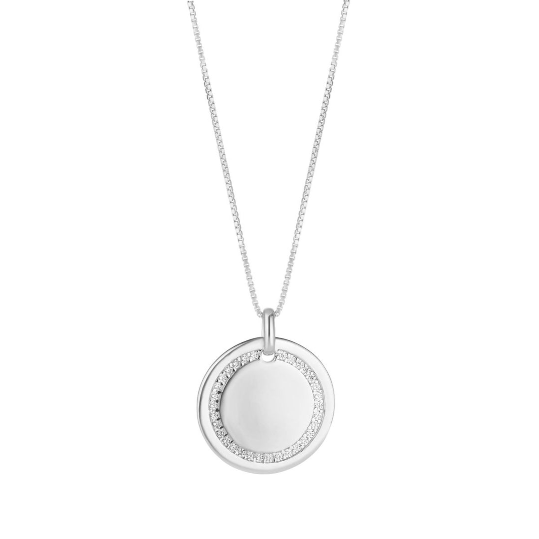 silver disc pendant with cubic set circle on white background