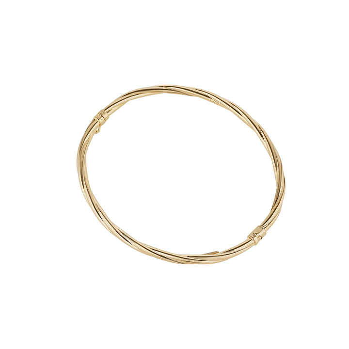 gold plated twist bangle on white background