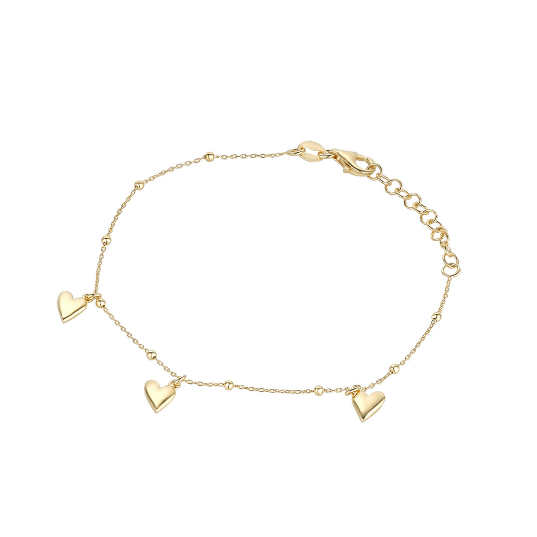 gold plated three heart bracelet on white background