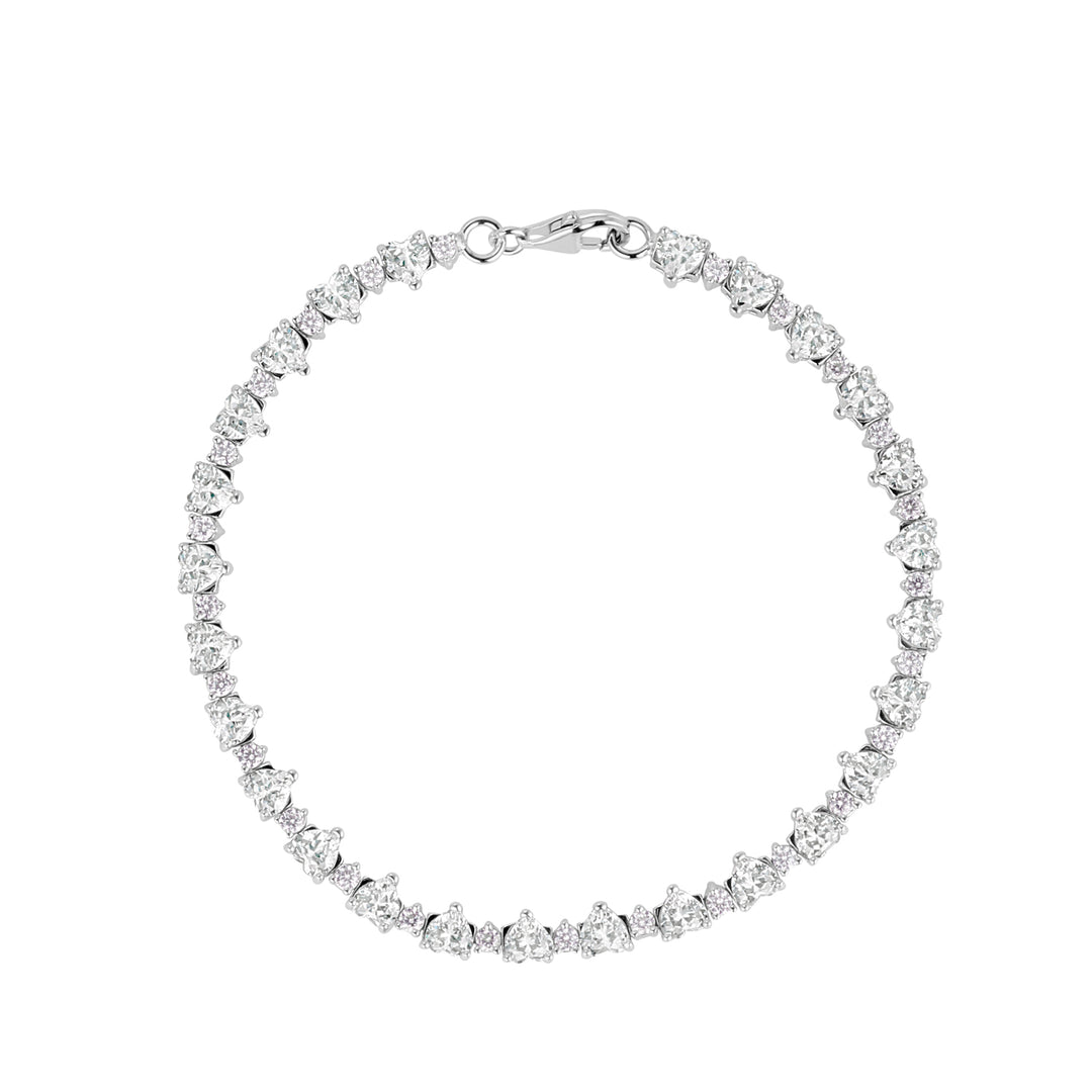 silver heart claw set tennis bracelet on white background