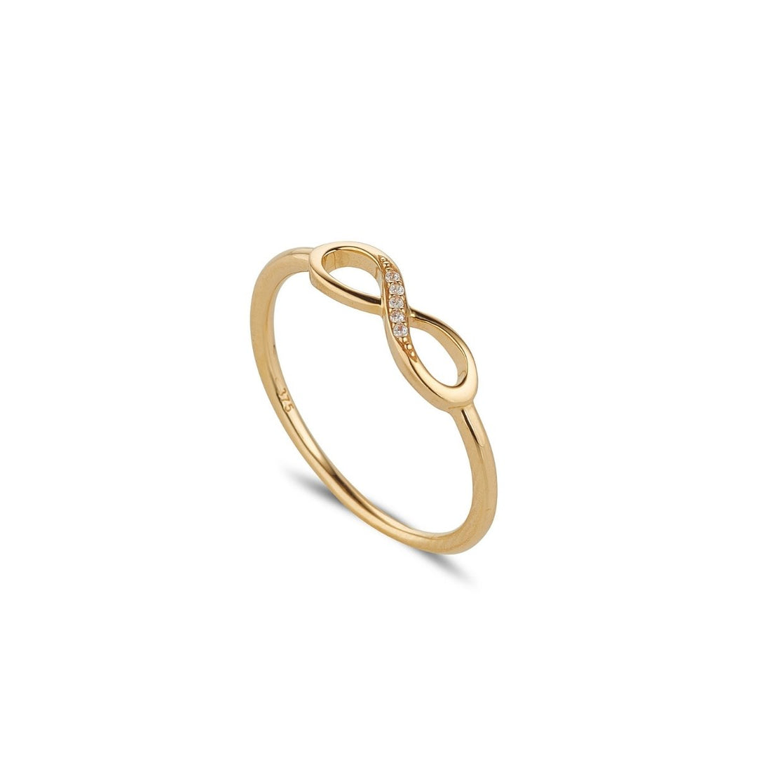 9ct gold infinity cubic zirconia set ring on white background