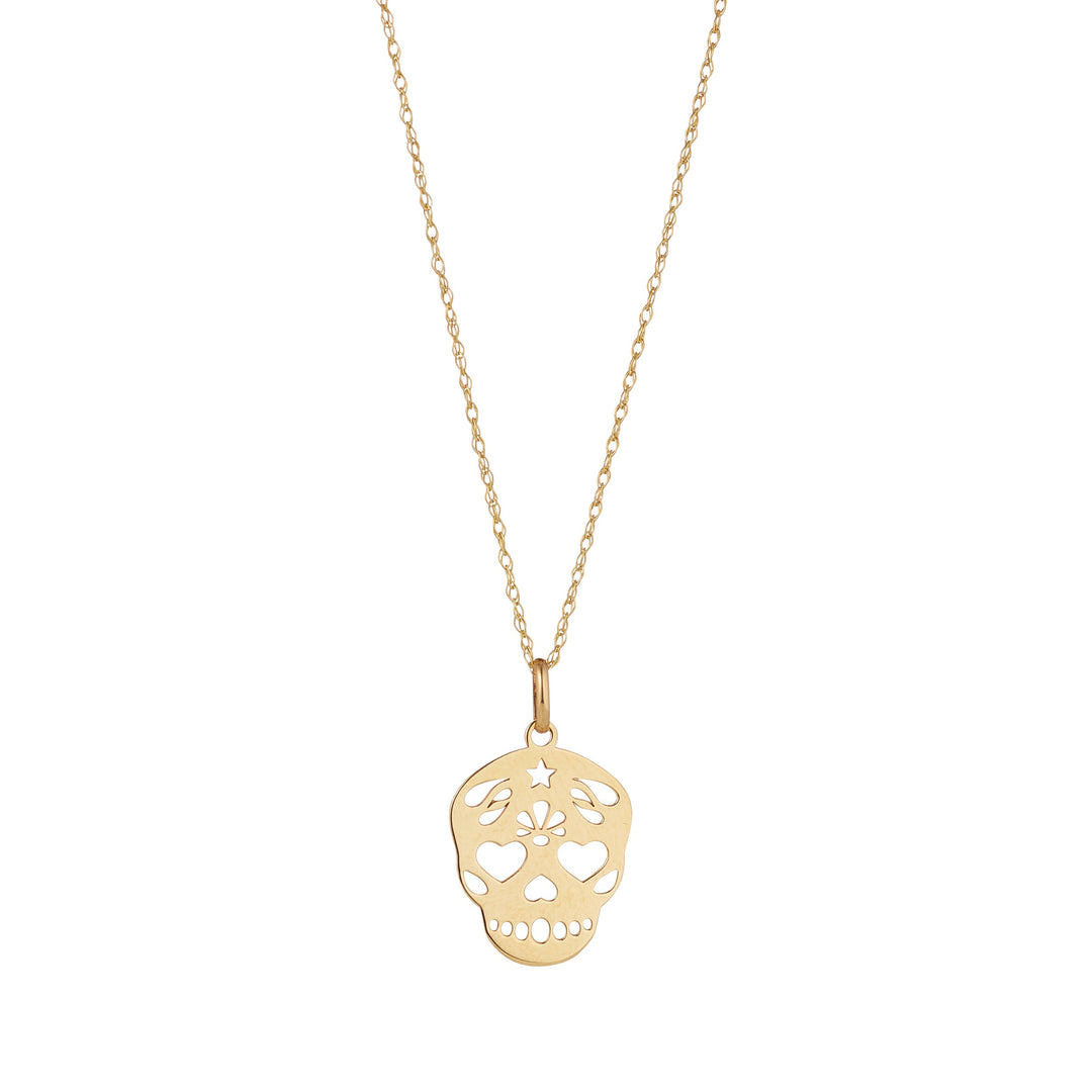 9ct gold sugar skull pendant on white background