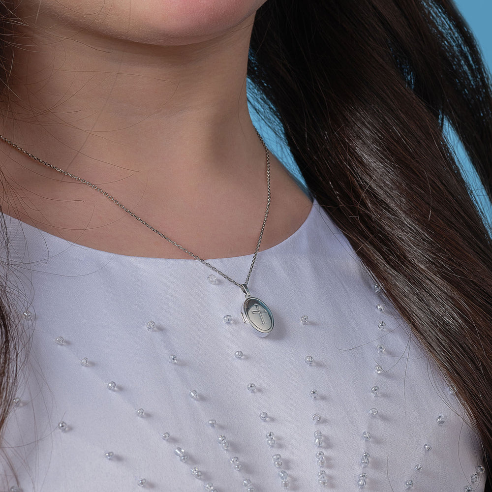 communion girl wearing cross locket