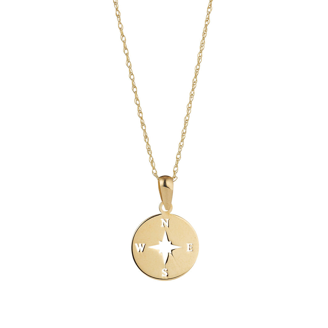 9ct gold compass pendant on white background