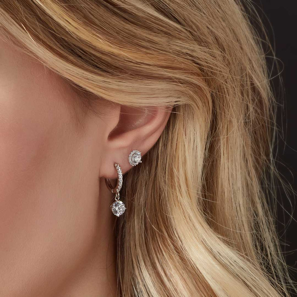 sterling silver huggie earrings with charm on model