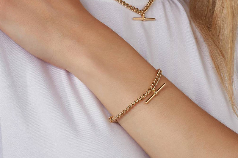 gold plated bracelet on a model's hand