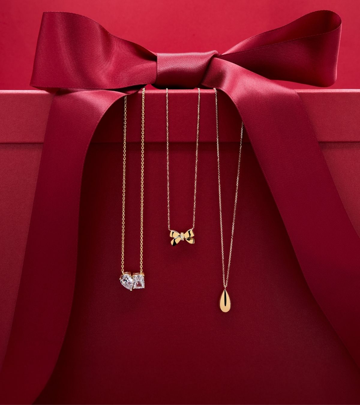 red present box with 9ct gold necklaces