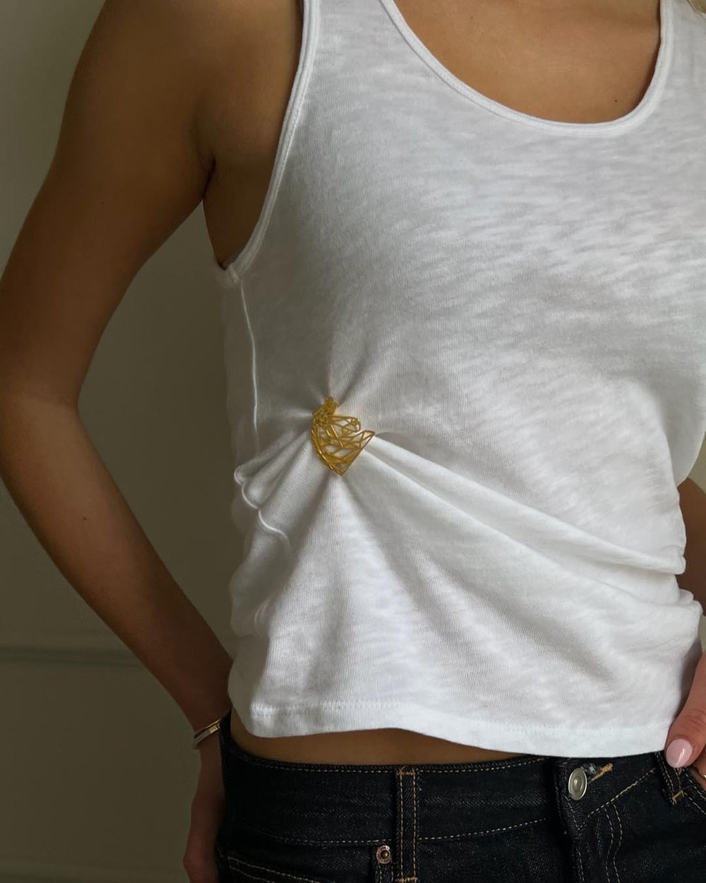 model wearing gold plated horse brooch