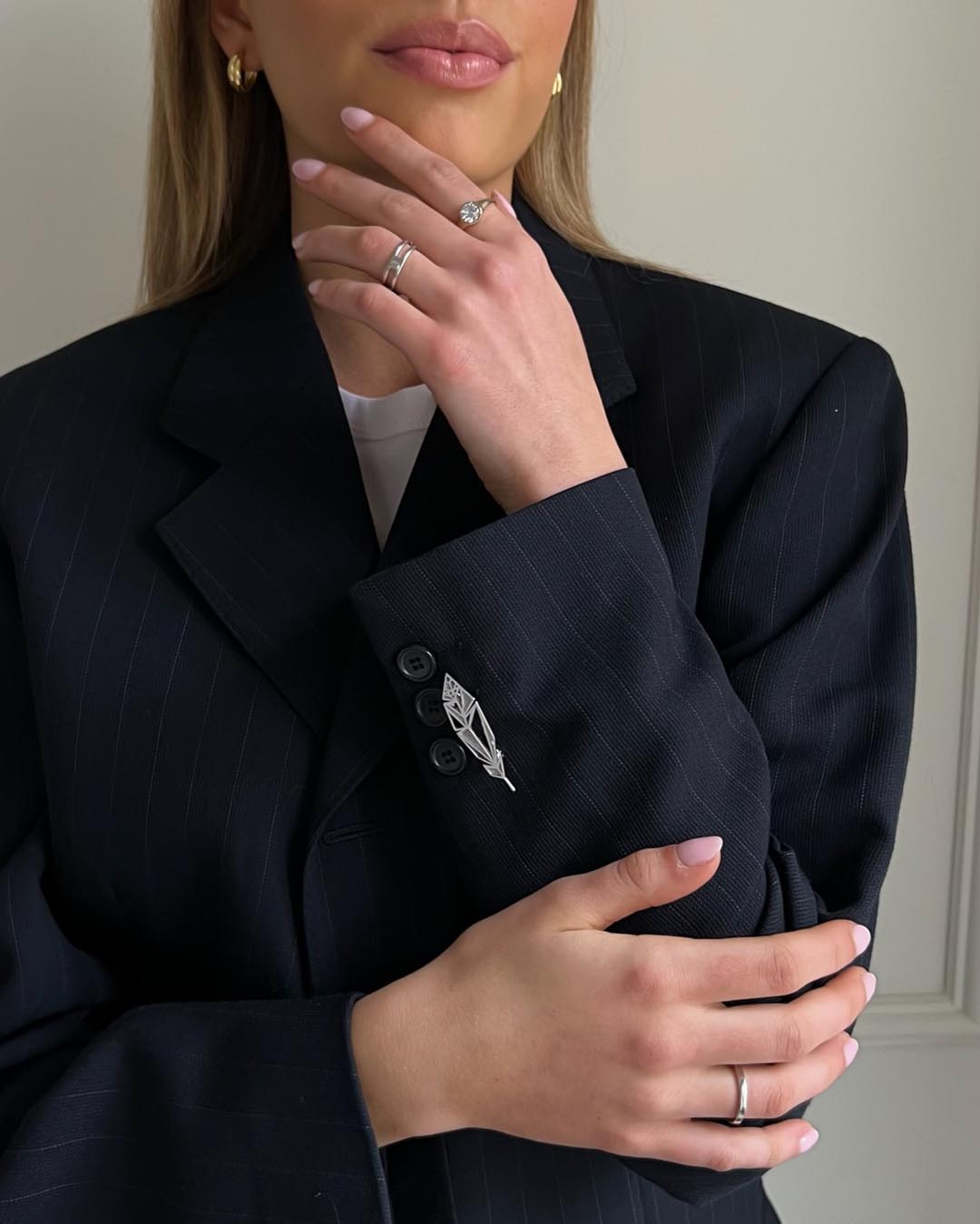 model wearing sterling silver filigree rose brooch