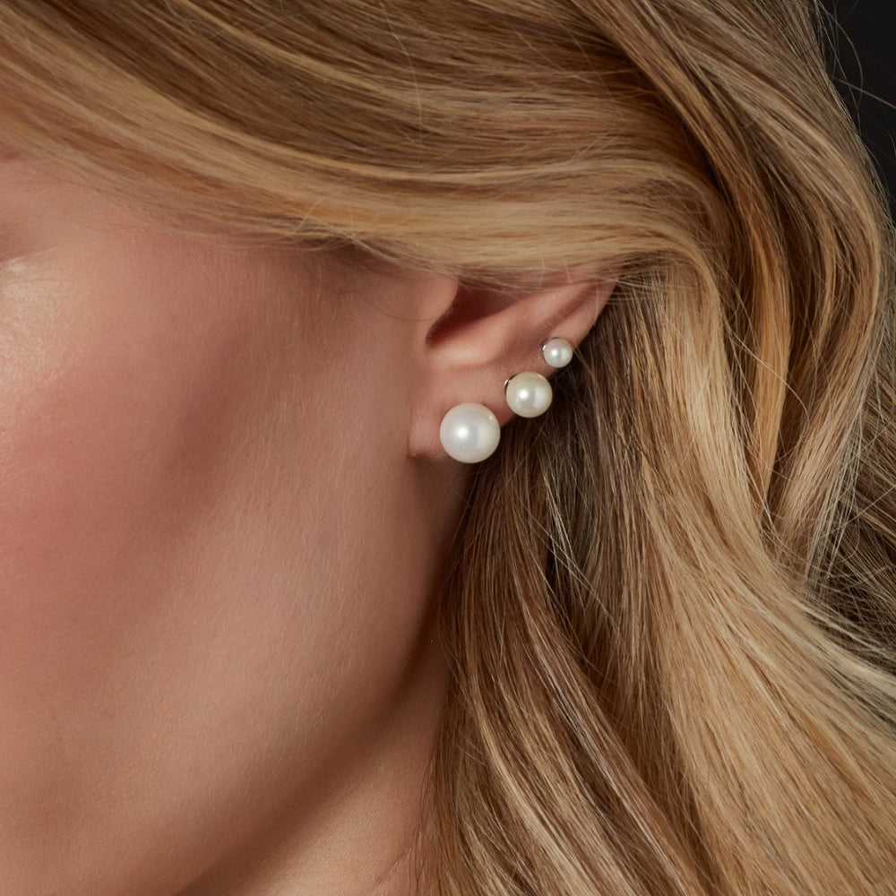 model wearing 9ct gold pearl stud earrings
