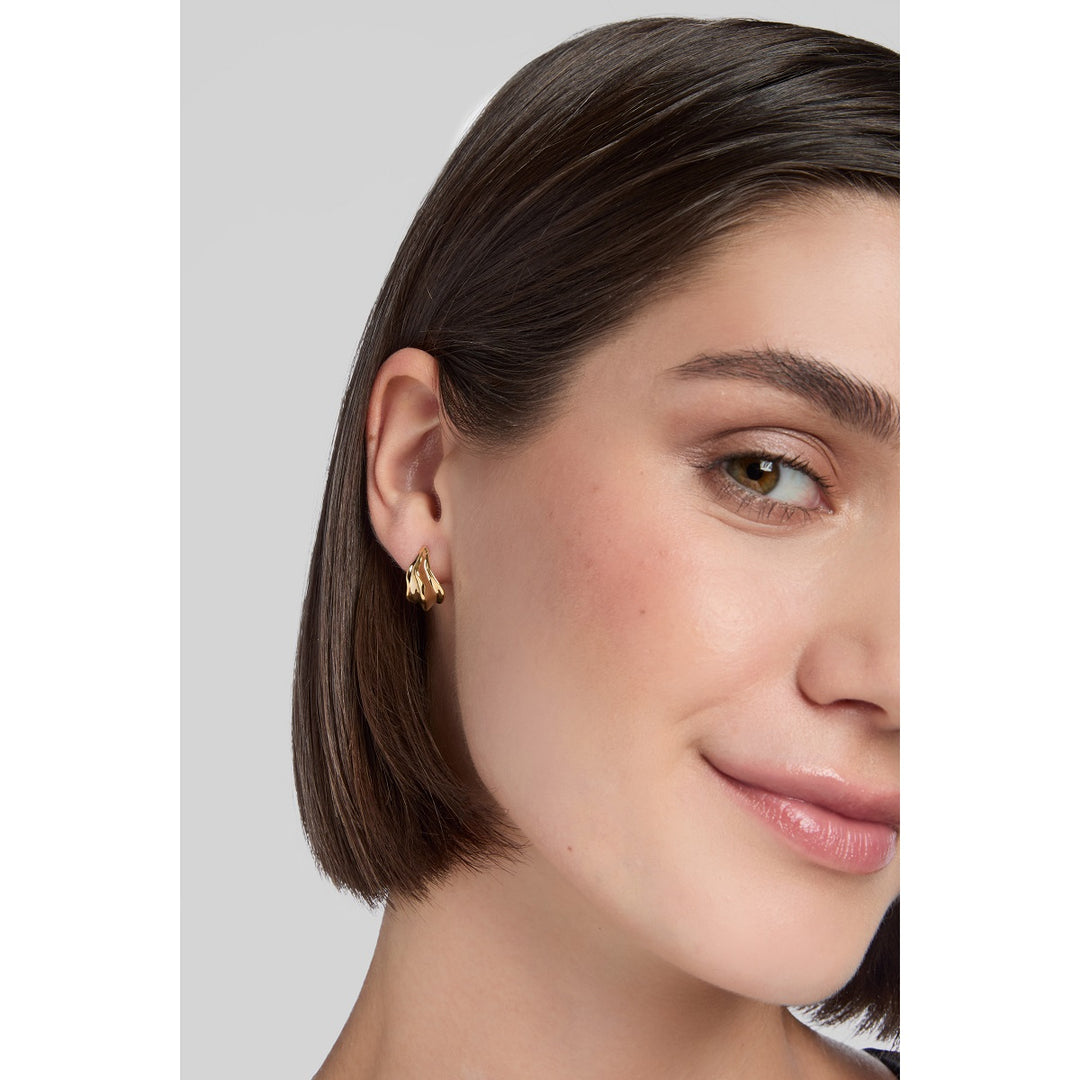 model wearing 18ct gold sterling silver Chunky Molten Hoop Earrings