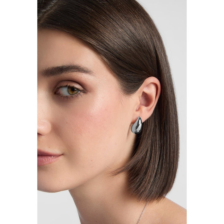 model wearing sterling silver chunky teardrop earrings