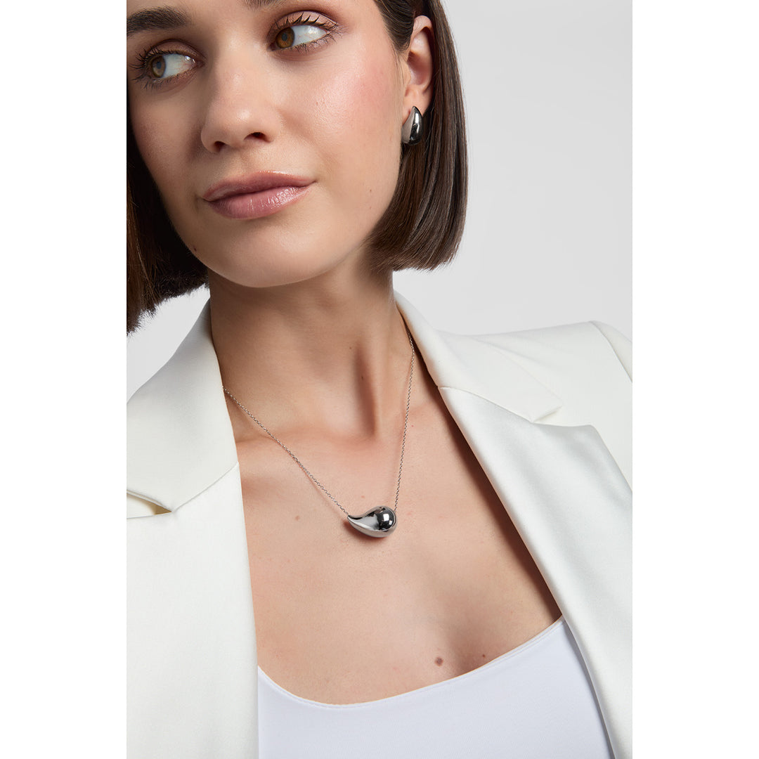 model wearing sterling silver chunky teardrop earrings and necklace