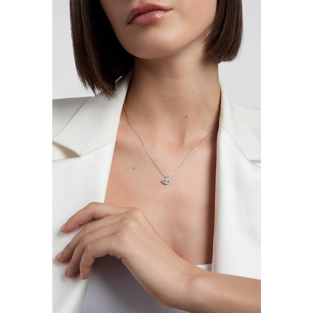 model wearing evil eye necklace in silver