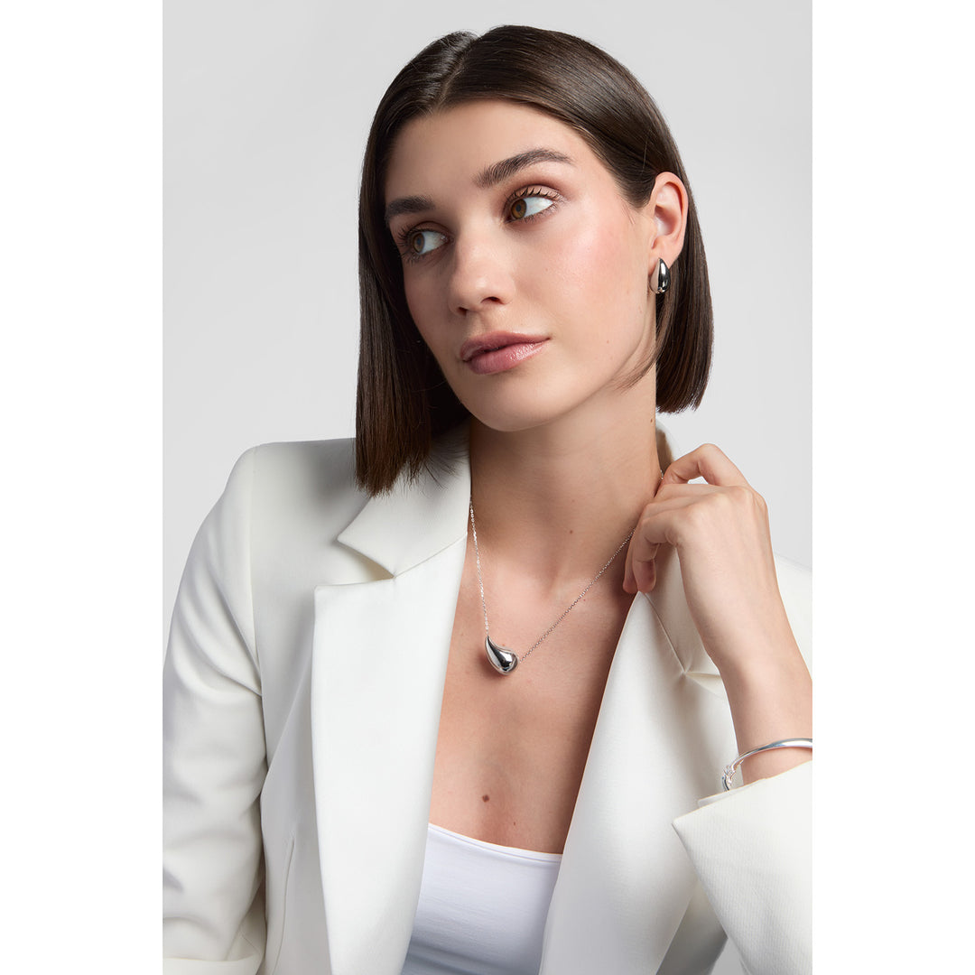 model wearing sterling silver chunky teardrop earrings and necklace