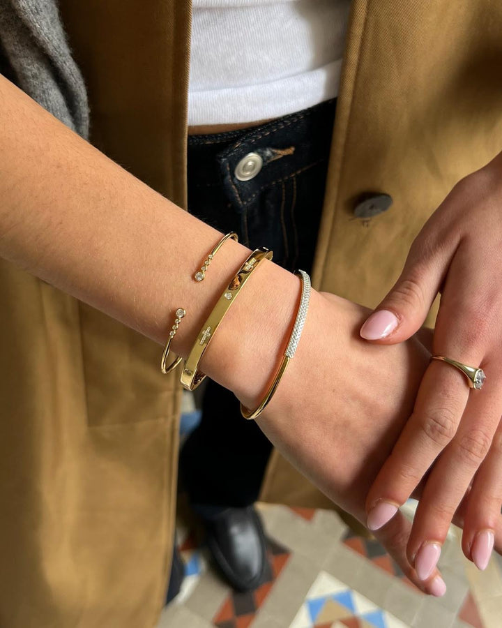 model wearing gold plated bangle stack