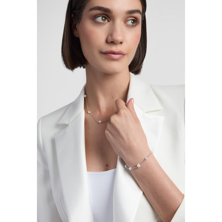 model wearing sterling silver pearl bracelet and necklace