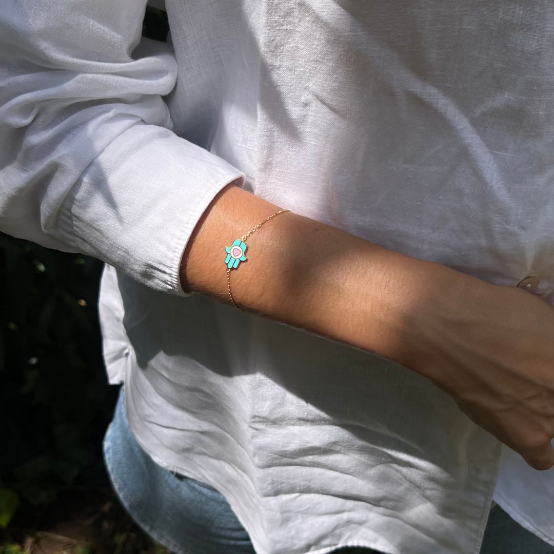 gold plated blue hand of fatima bracelet on model