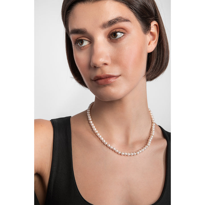 model wearing 9ct gold pearl necklace